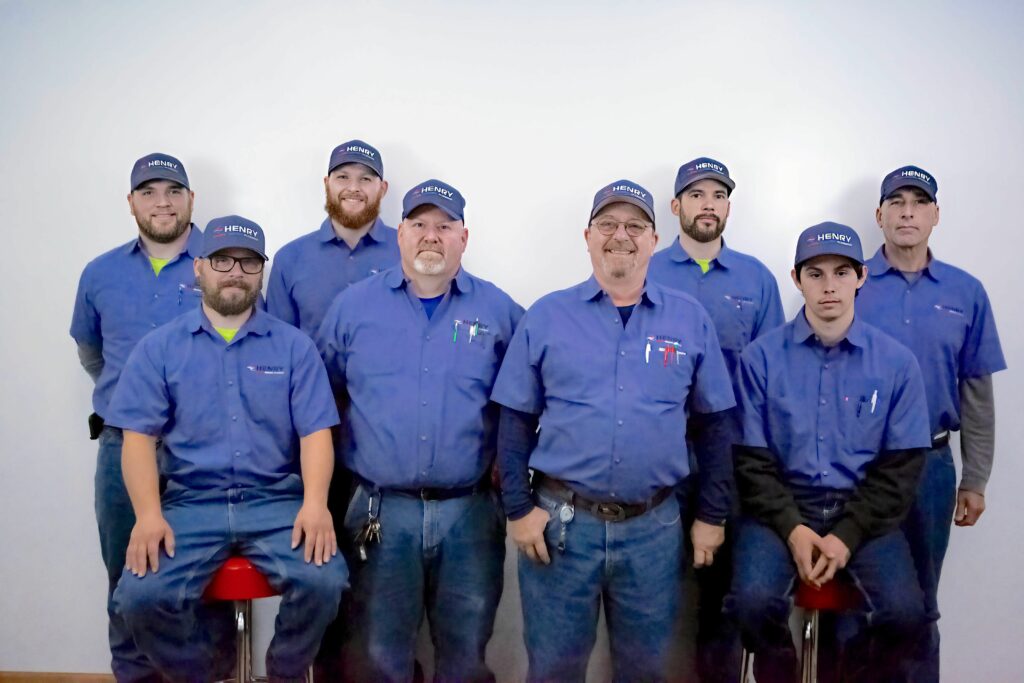 Henry Heating, Cooling, and Plumbing Service team photo.
